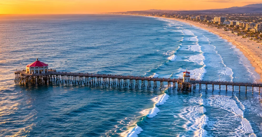 Huntington Beach Pier at sunset, looking down the coast
